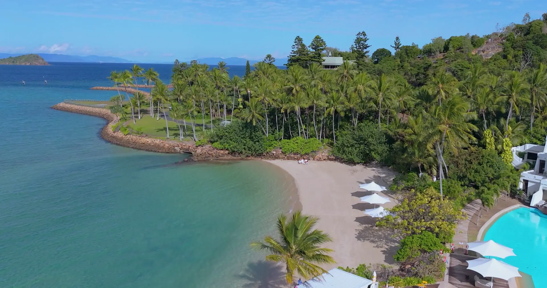 Aerial drone footage of a Whitsundays resort beach by Jordan Cullen Photo