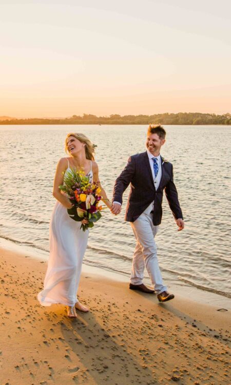 Wedding photo with sunset and flowers / bouqet photo by Jordan Cullen, Mackay Photographer & Filmmaker.